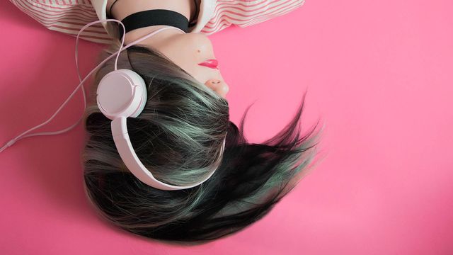 A girl with headphones on.
