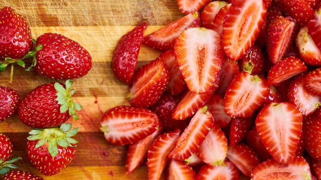 Whole and halved strawberries