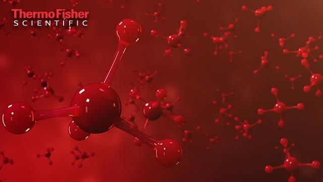 Small red molecular structures on a red background.
